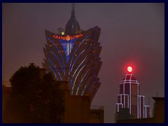 Grand Lisboa Hotel, Macau's tallest building, changing colours after dark.